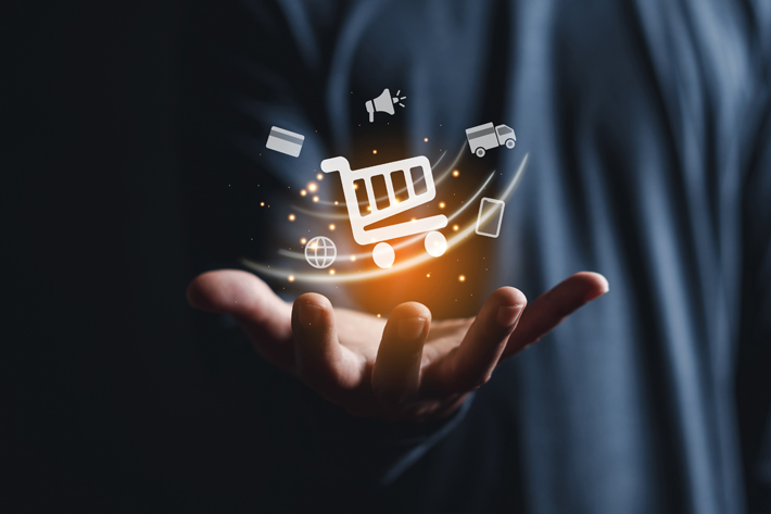 Digital hand holding RFID-enabled retail and eCommerce icons for automated shopping and logistics